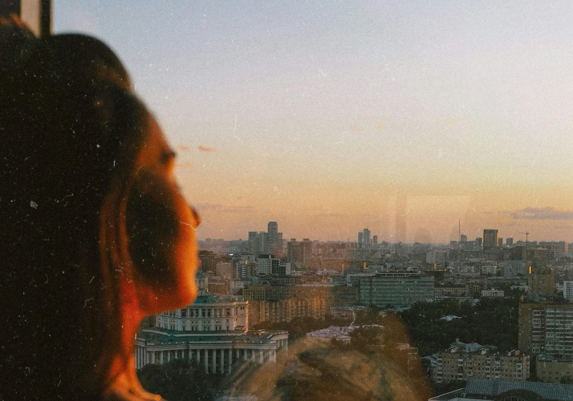 Understanding relationship triggers. Person pausing in quiet reflection, symbolising awareness and emotional insight.